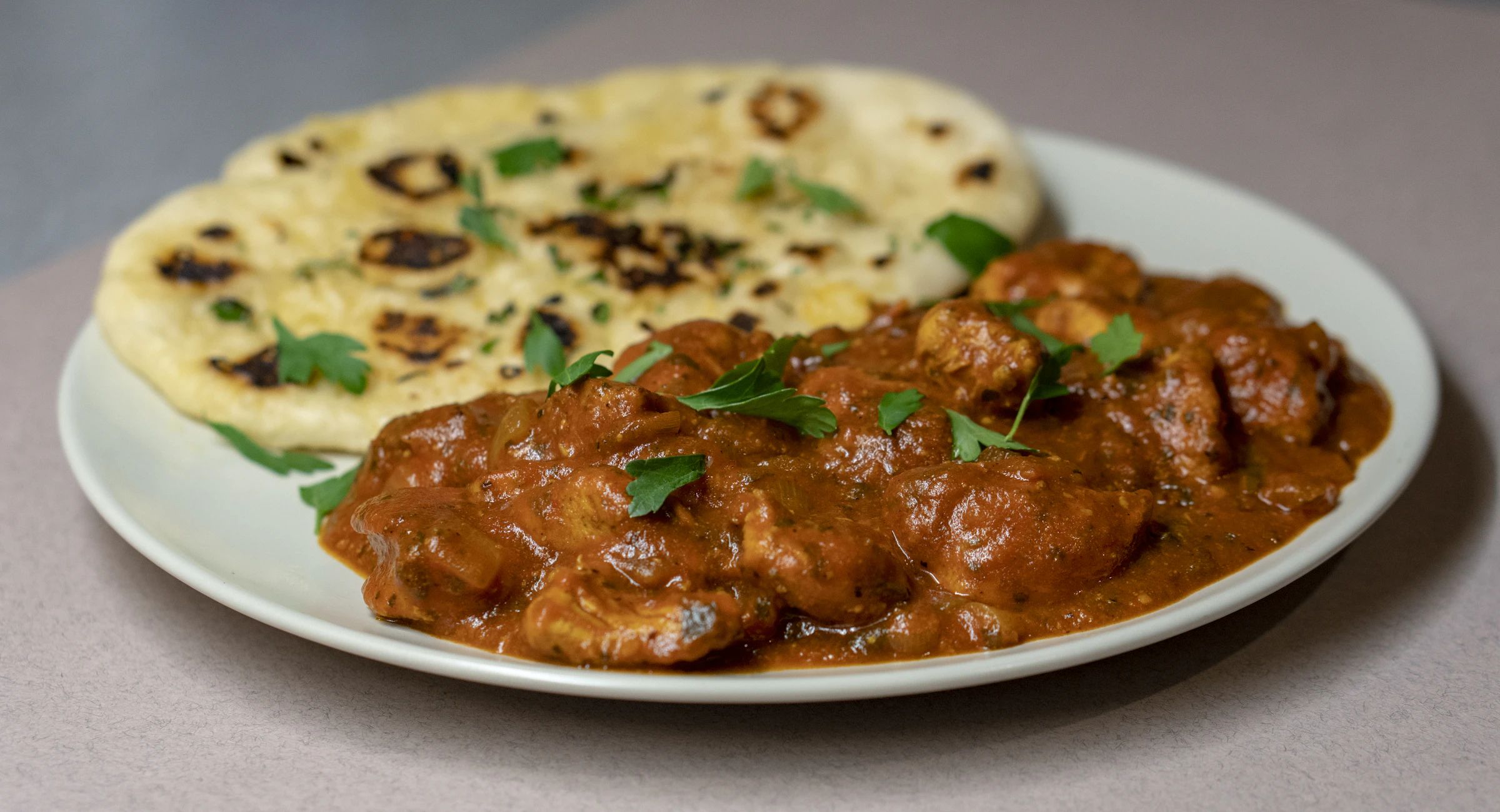 Indian curry served with naan for restaurant supply